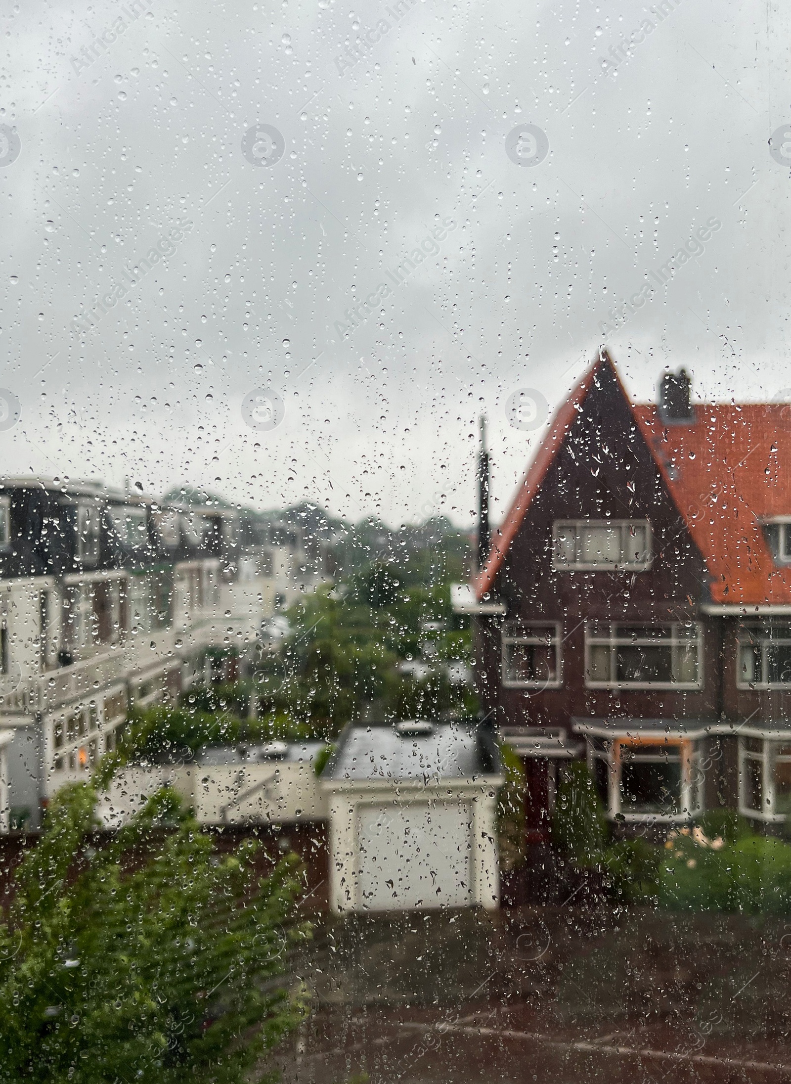 Photo of Window glass with water drops, view from inside. Rainy weather