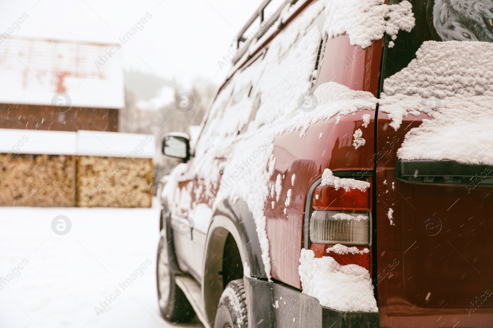 Photo of Car covered with snow after storm outdoors on beautiful winter day, closeup