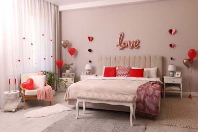 Photo of Cozy bedroom decorated for Valentine Day. Interior design