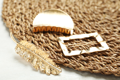 Beautiful different hair clips on white table, closeup