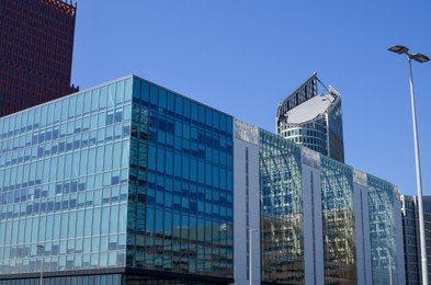 Photo of Exterior of beautiful modern buildings against blue sky