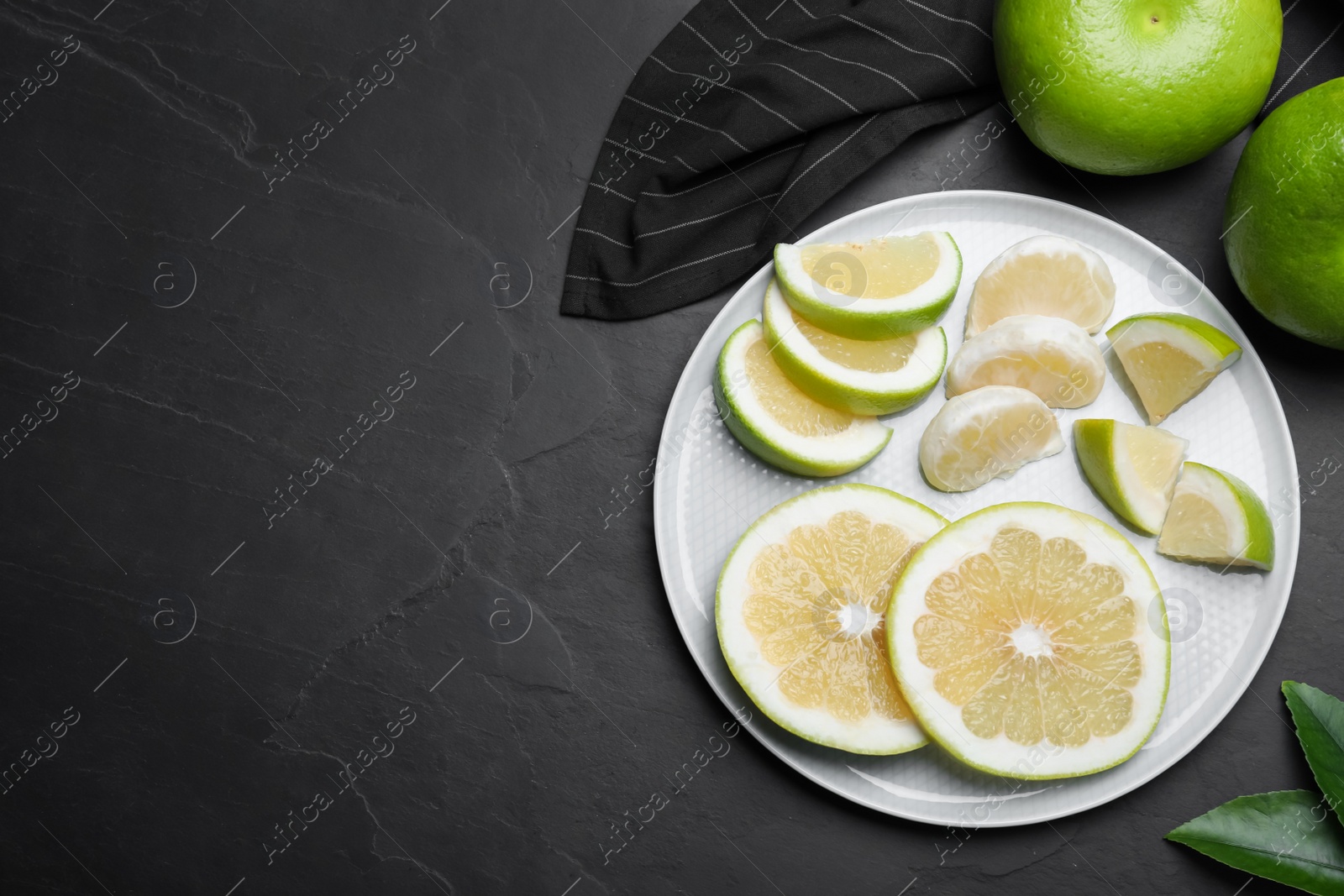 Photo of Fresh ripe sweeties on black table, flat lay. Space for text