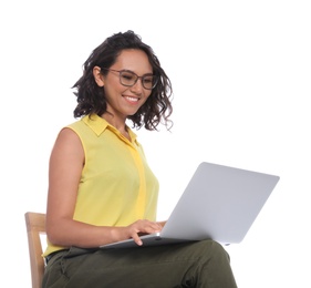 Photo of Happy young woman sitting on chair and working with laptop on white background