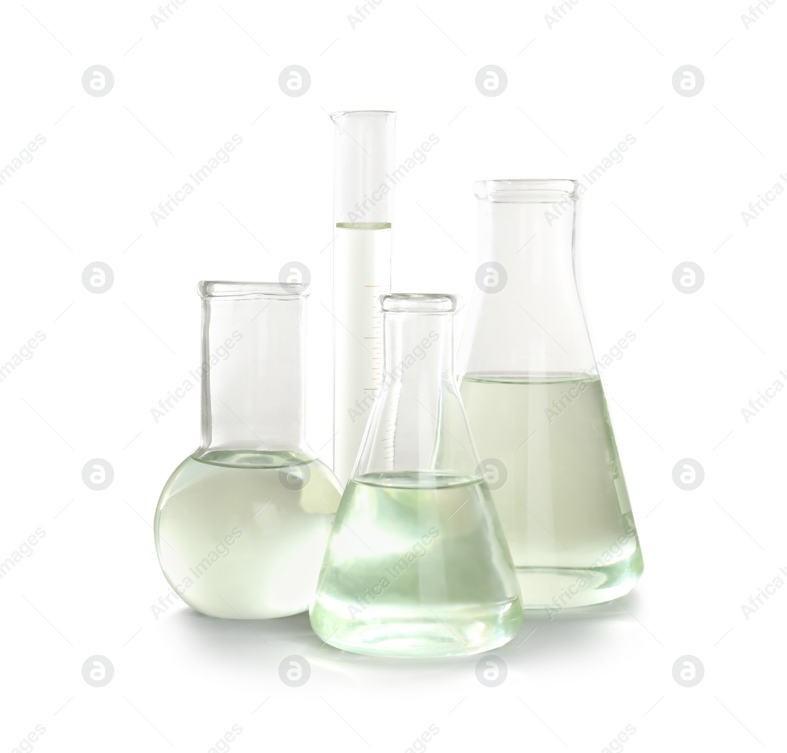 Photo of Laboratory glassware with liquid on white background. Chemical analysis