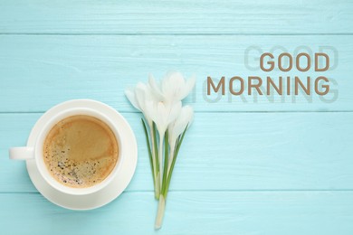 Image of Good Morning! Cup of morning coffee and crocuses on light blue wooden table, flat lay