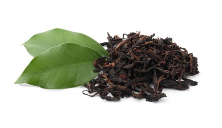 Photo of Pile of Traditional Chinese pu-erh tea and fresh leaves isolated on white