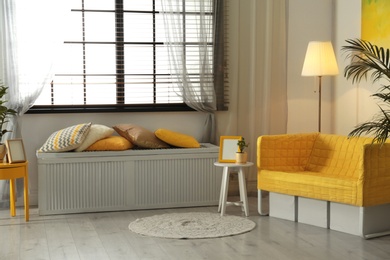 Photo of Stylish living room interior with modern furniture near window