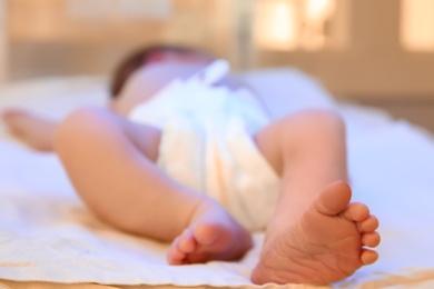 Photo of Newborn child under ultraviolet light in hospital, closeup