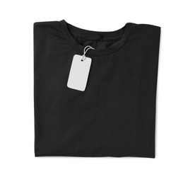 Photo of Stylish black T-shirt with label isolated on white, top view