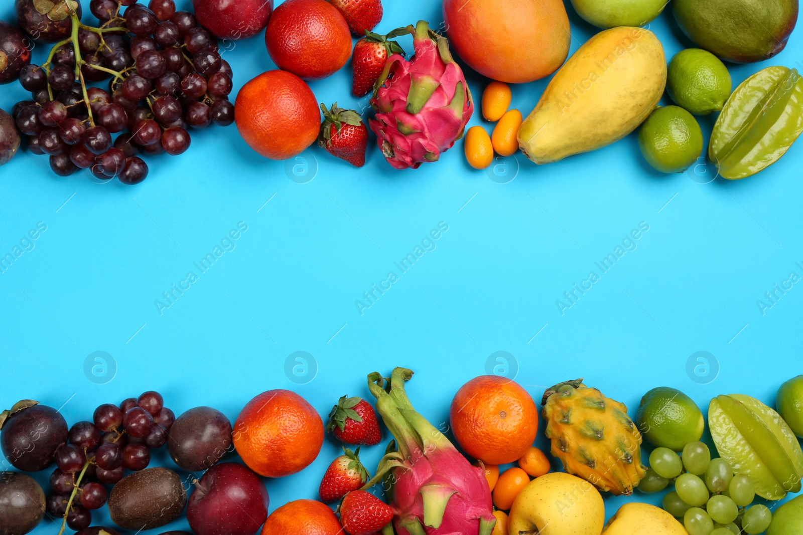 Photo of Assortment of fresh exotic fruits on light blue background, flat lay. Space for text