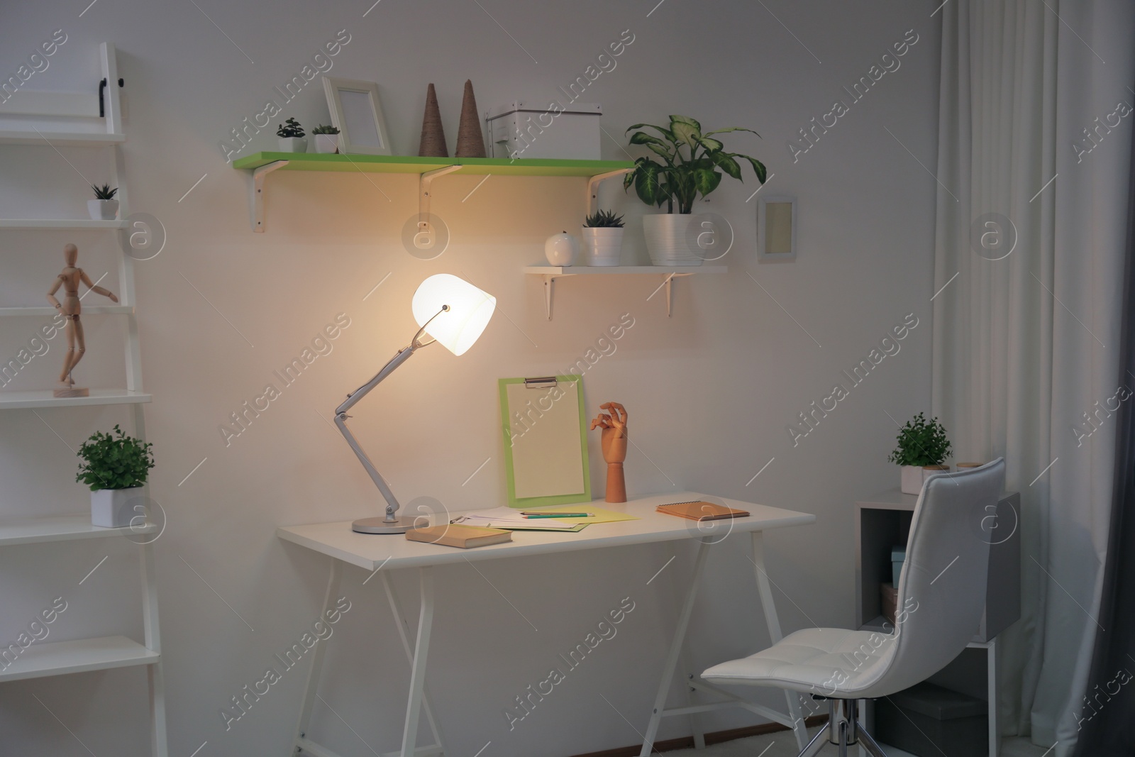 Photo of Stylish room interior with comfortable workplace. Design idea
