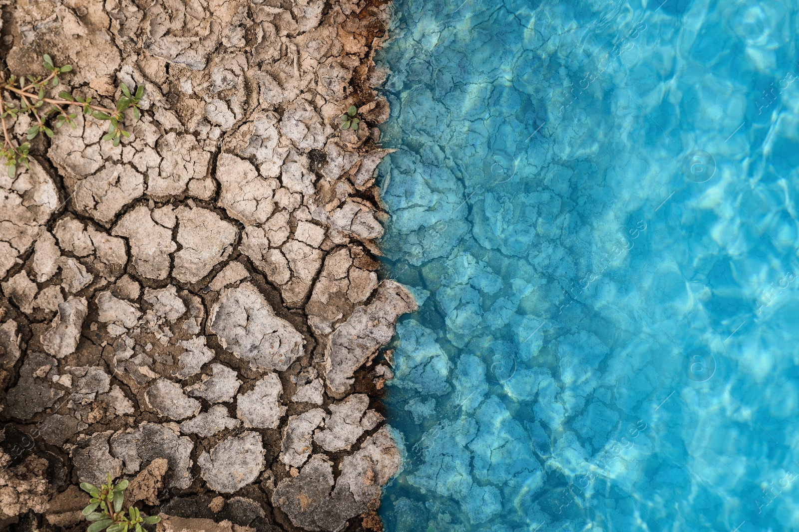 Image of Save environment. Water on dry cracked land, top view