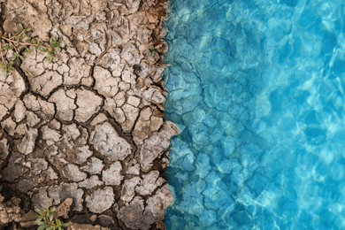 Image of Save environment. Water on dry cracked land, top view