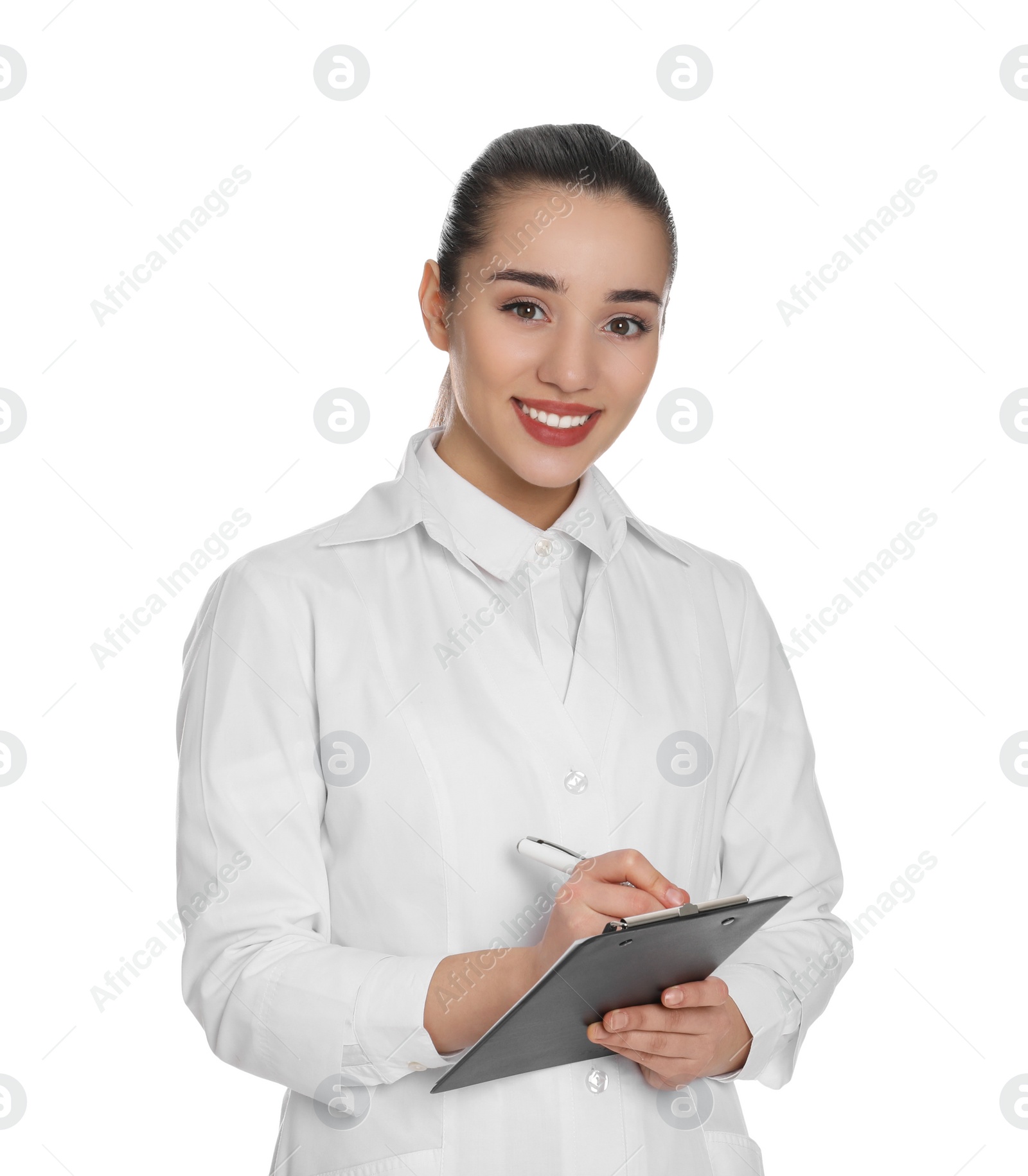 Photo of Happy young woman in lab coat with clipboard on white background