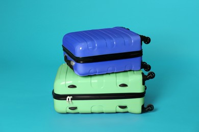 Image of Modern suitcases for travelling on blue background