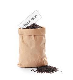 Photo of Paper bag with uncooked black rice and card on white background