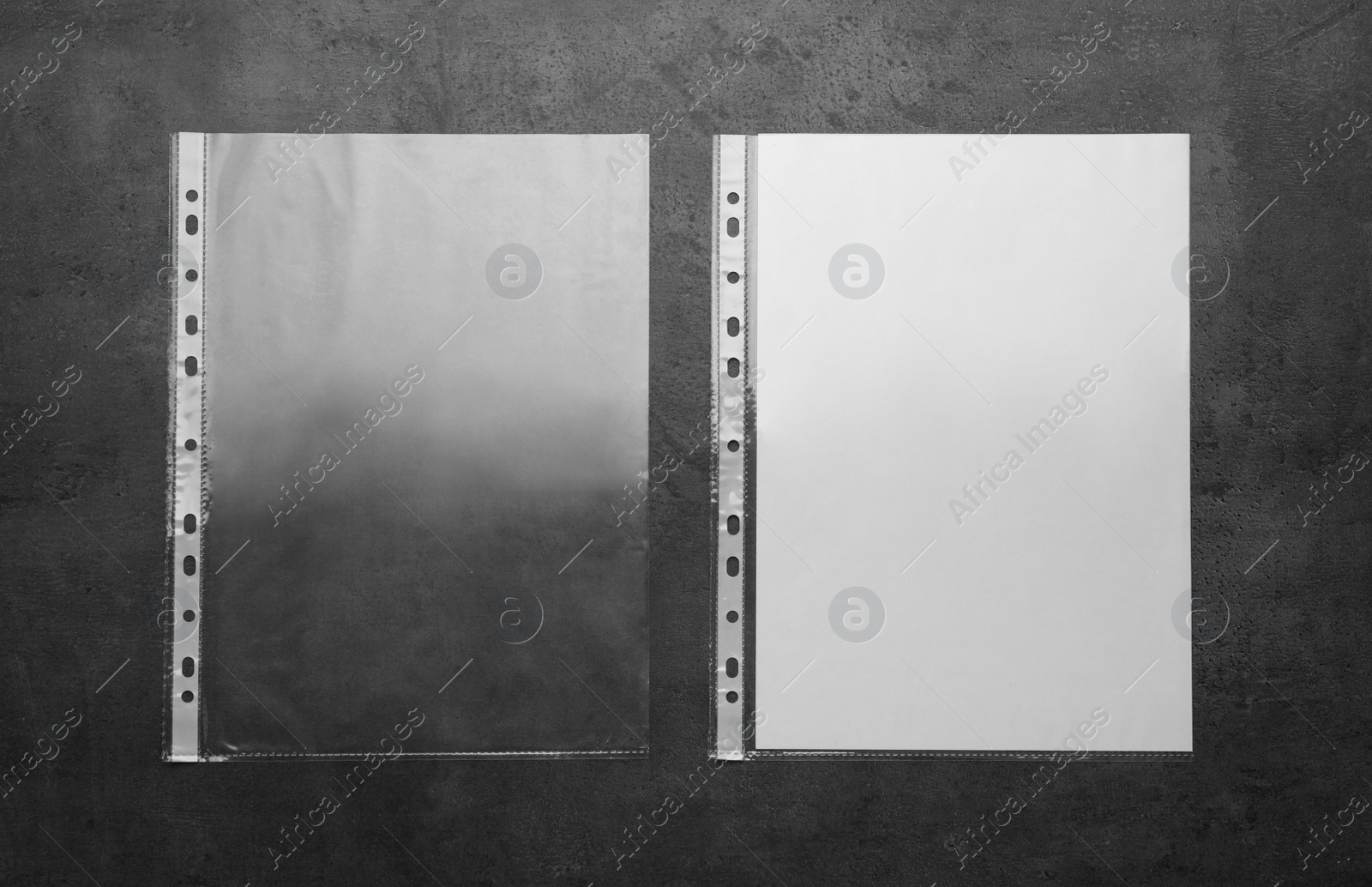 Photo of Punched pockets on light grey table, flat lay