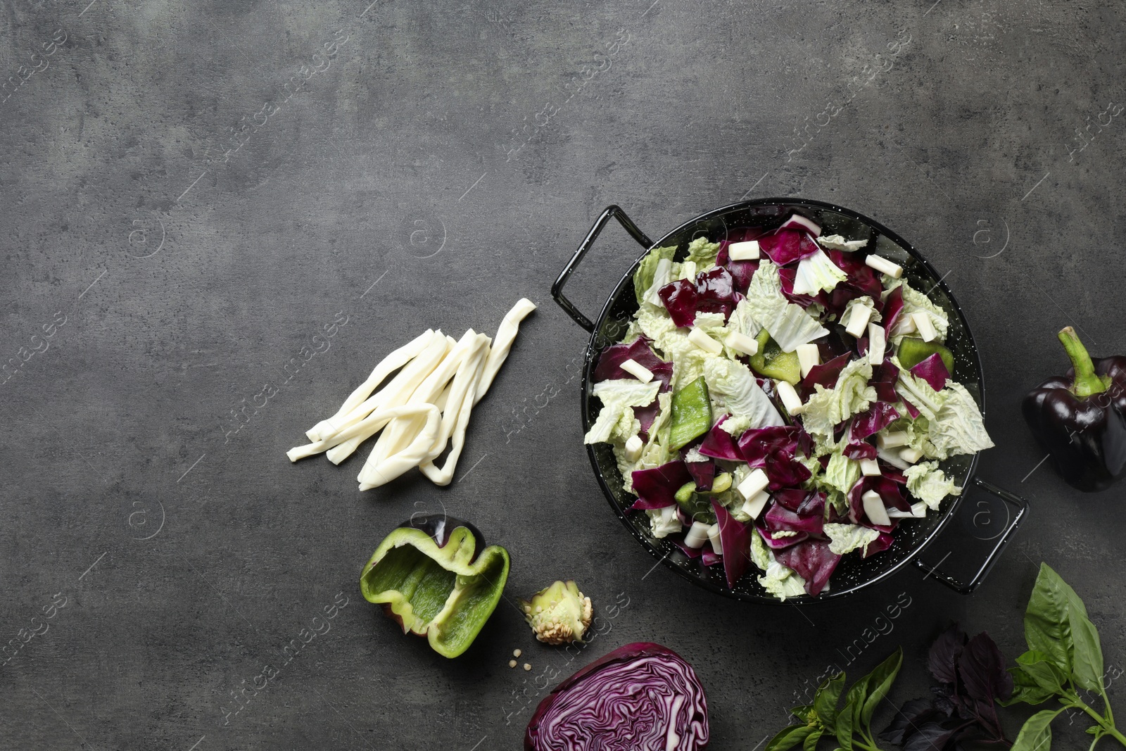 Photo of Delicious salad with Chinese cabbage, suluguni cheese and bell pepper on grey table, flat lay. Space for text