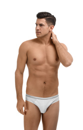 Handsome man in underwear on white background