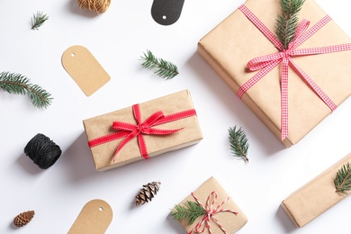 Photo of Flat lay composition with gift boxes on white background