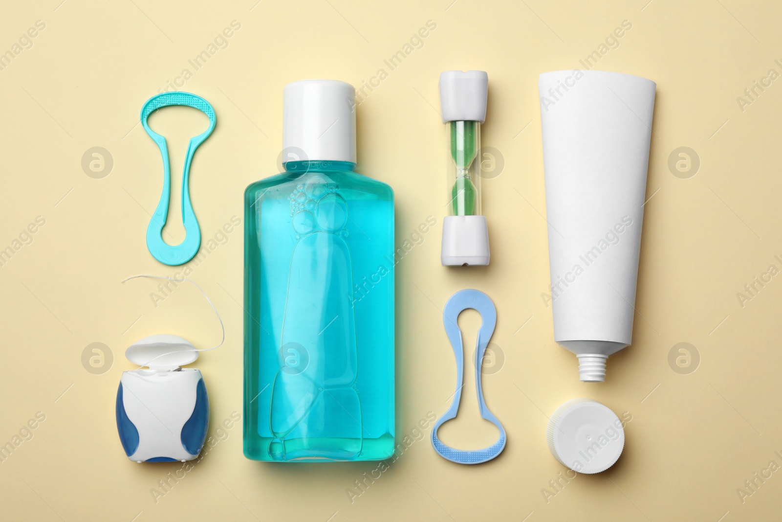 Photo of Flat lay composition with tongue cleaners and teeth care products on color background