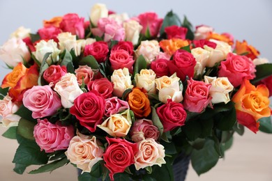 Photo of Bouquet of beautiful roses on light background, closeup