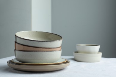 Stylish empty dishware on table. Space for text