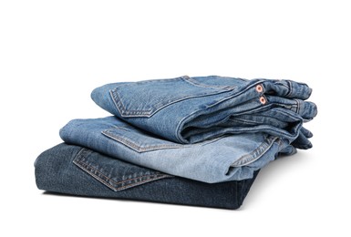 Image of Stack of different folded jeans isolated on white