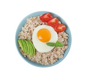Photo of Delicious boiled oatmeal with fried egg, avocado and tomato in bowl isolated on white, top view