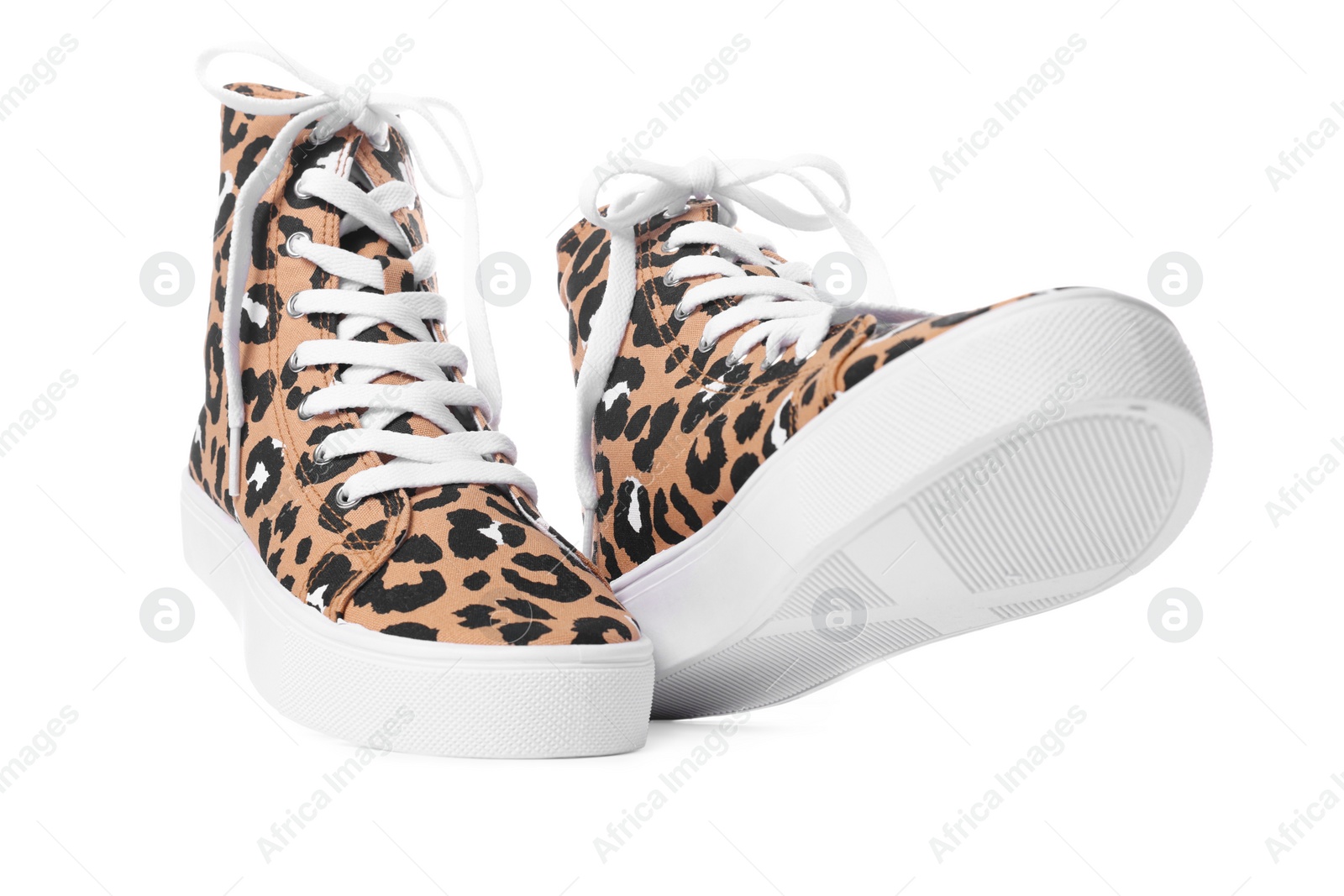 Photo of Pair of classic old school sneakers on white background