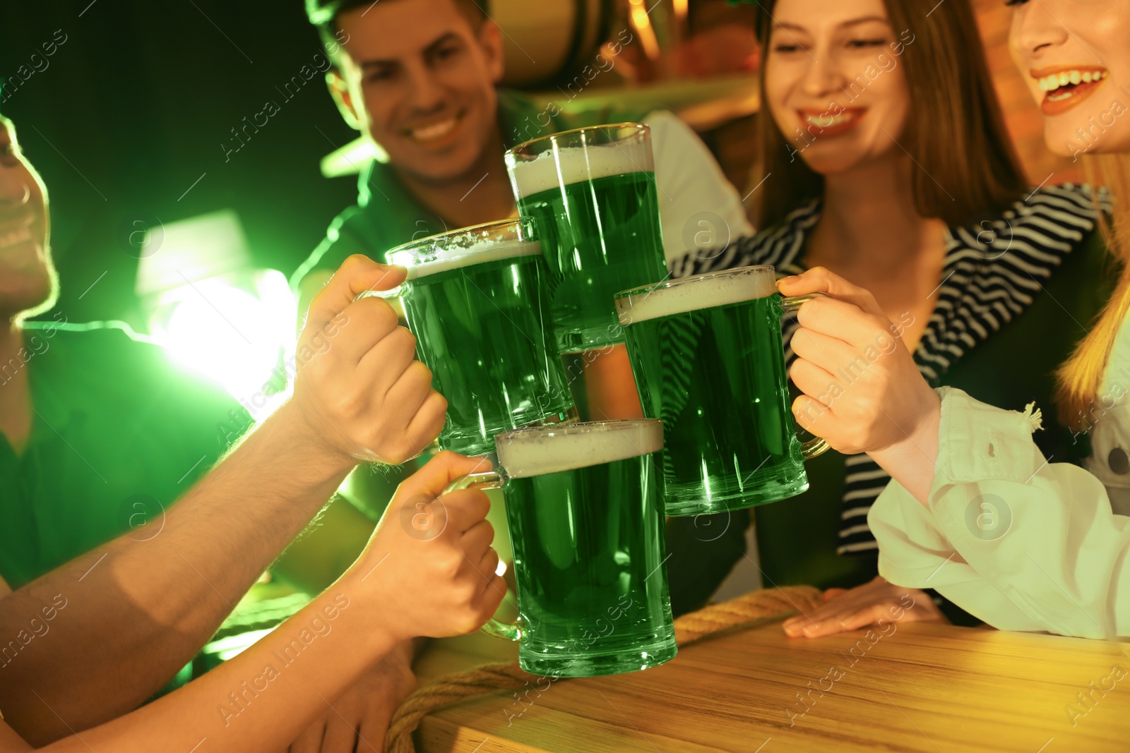 Photo of People with beer celebrating St Patrick's day in pub