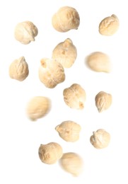 Many chickpeas falling on white background. Vegan diet  