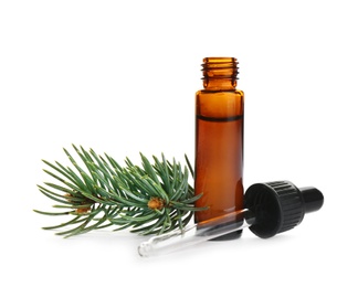 Little open bottle with essential oil, dropper and pine branch on white background