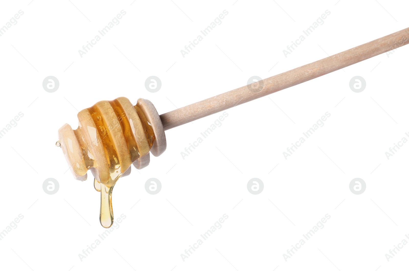 Photo of Fresh honey dripping from dipper on white background