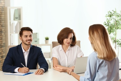 Human resources commission conducting job interview with applicant in office