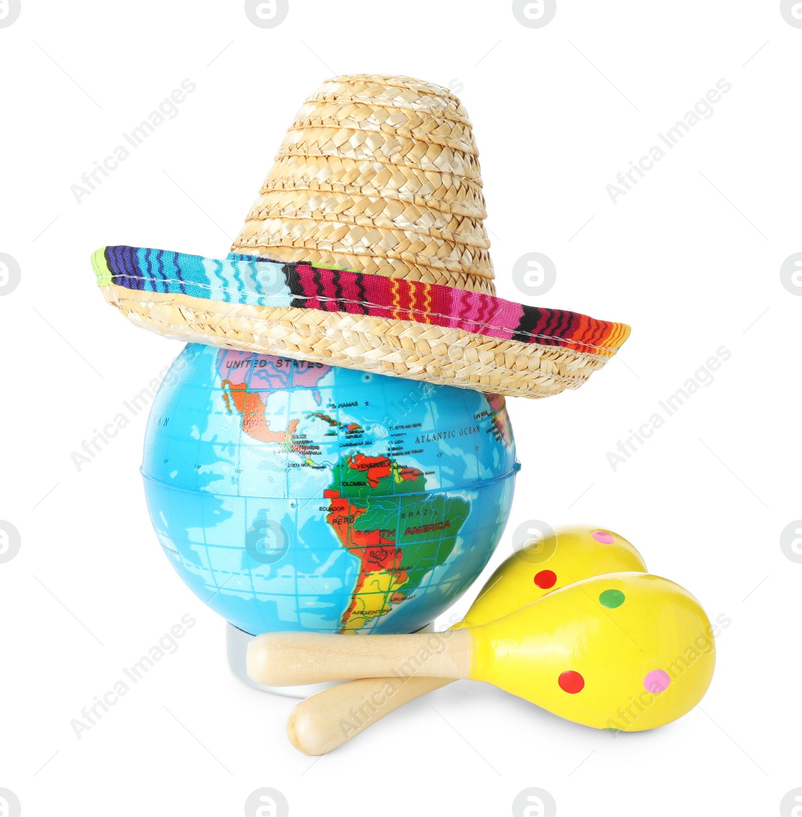 Photo of Globe with Mexican sombrero hat and maracas isolated on white