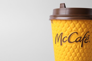 Photo of MYKOLAIV, UKRAINE - AUGUST 12, 2021: Hot McDonald's drink on light background, closeup. Space for text