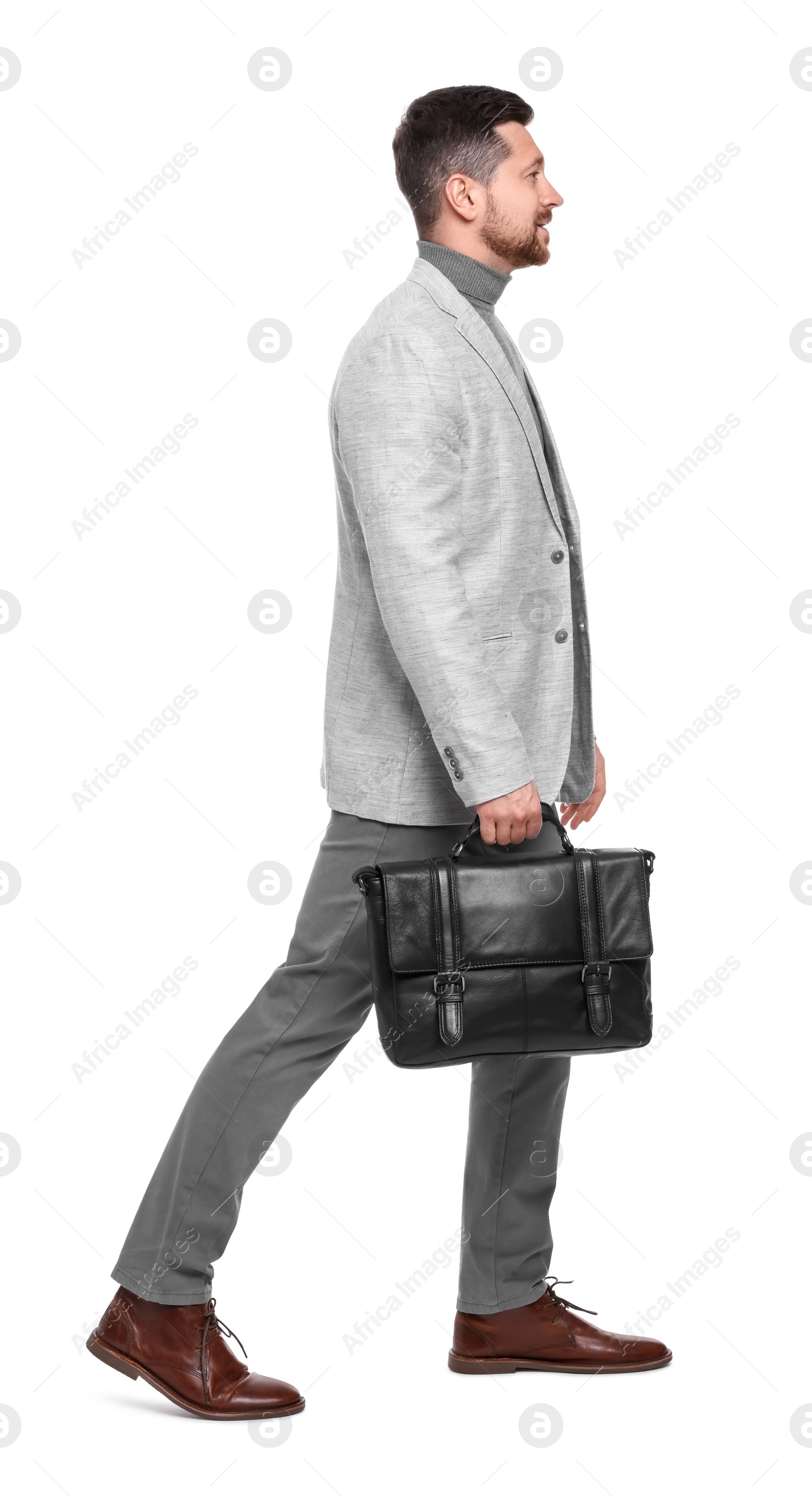 Photo of Handsome bearded businessman with briefcase on white background