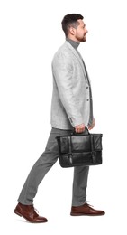 Handsome bearded businessman with briefcase on white background