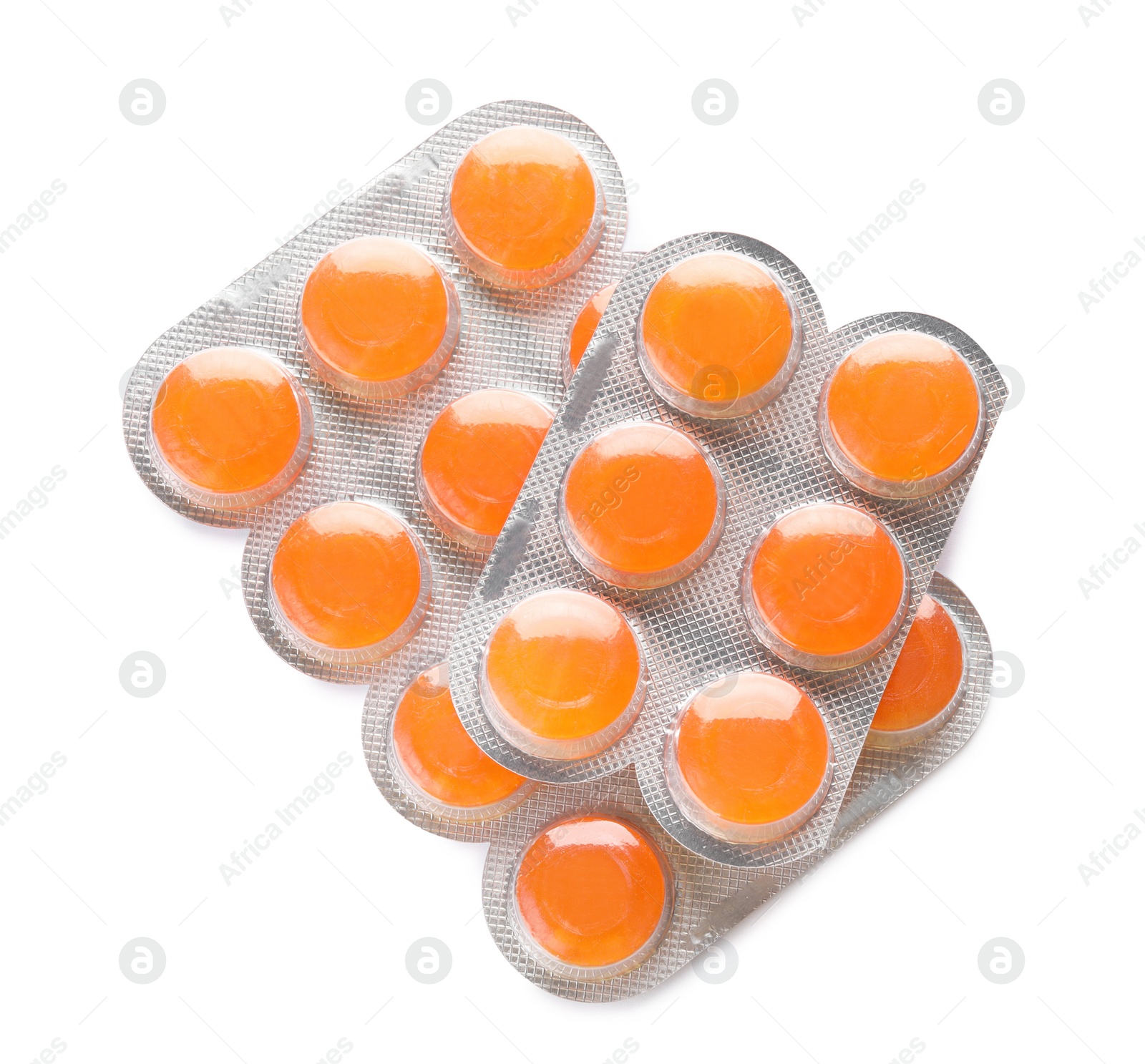 Photo of Blisters with orange cough drops on white background, top view