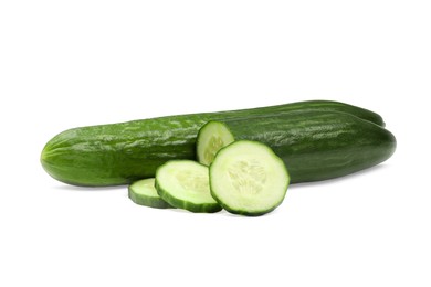 Photo of Whole and cut long cucumbers isolated on white