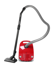 Modern red vacuum cleaner isolated on white