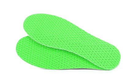 Image of Pair of green orthopedic insoles on white background