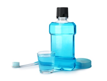 Photo of Mouthwash and other items for teeth care on white background