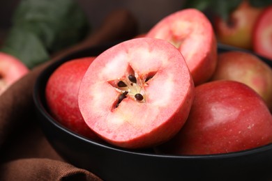 Tasty apples with red pulp on table, closeup