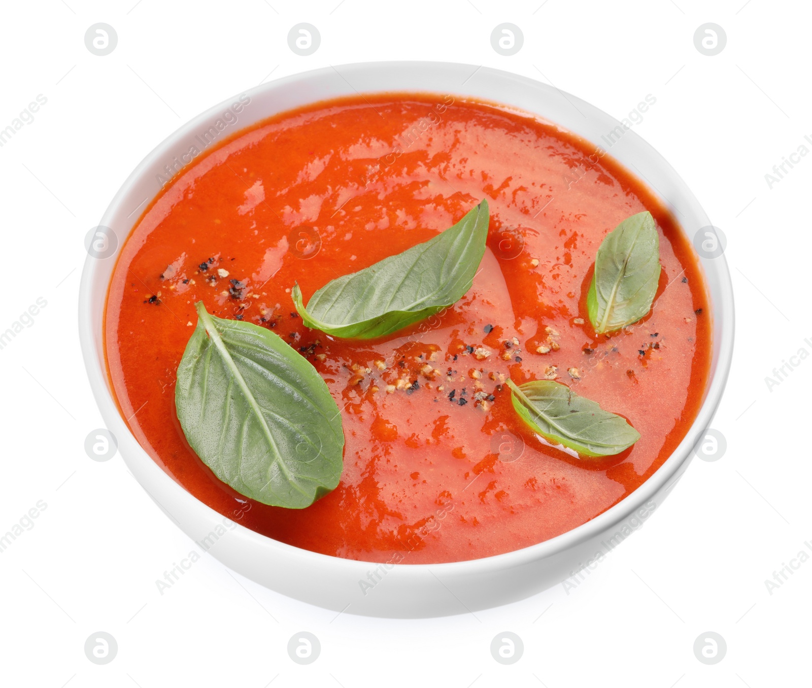 Photo of Delicious tomato soup with basil and spices isolated on white