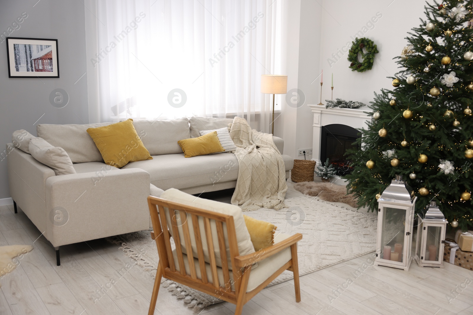 Photo of Christmas tree in furnished living room. Festive interior design