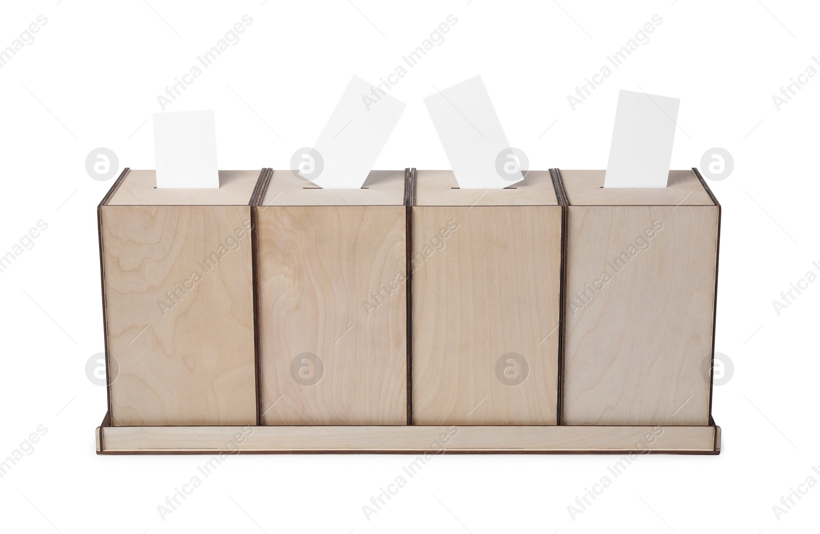 Photo of Wooden ballot boxes with votes isolated on white