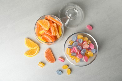 Tasty sweets on light grey table, flat lay