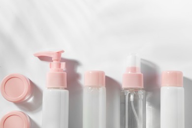 Photo of Cosmetic travel kit on white background, top view